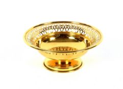 A small circular silver gilt bon bon dish, having pierced border, Birmingham 1962, 13cm dia.,