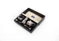 A George V cased silver salt, London 1932, a plated mustard pot and pepper having odd spoons,