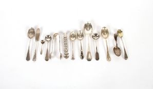 A small collection of various silver teaspoons, condiment spoons, sugar nips and a butter knife,