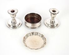 A pair of silver dwarf candlesticks, Birmingham 1905, with loaded bases AF, 9cm high; a silver pie