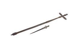 An iron Ethiopian coptic cross of typical form, 51cm long and a Yoruba bronze spike with kneeling