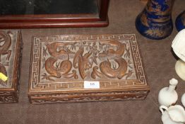 An Eastern carved hardwood box having dragon and f