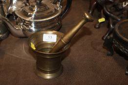 A brass pestle and mortar
