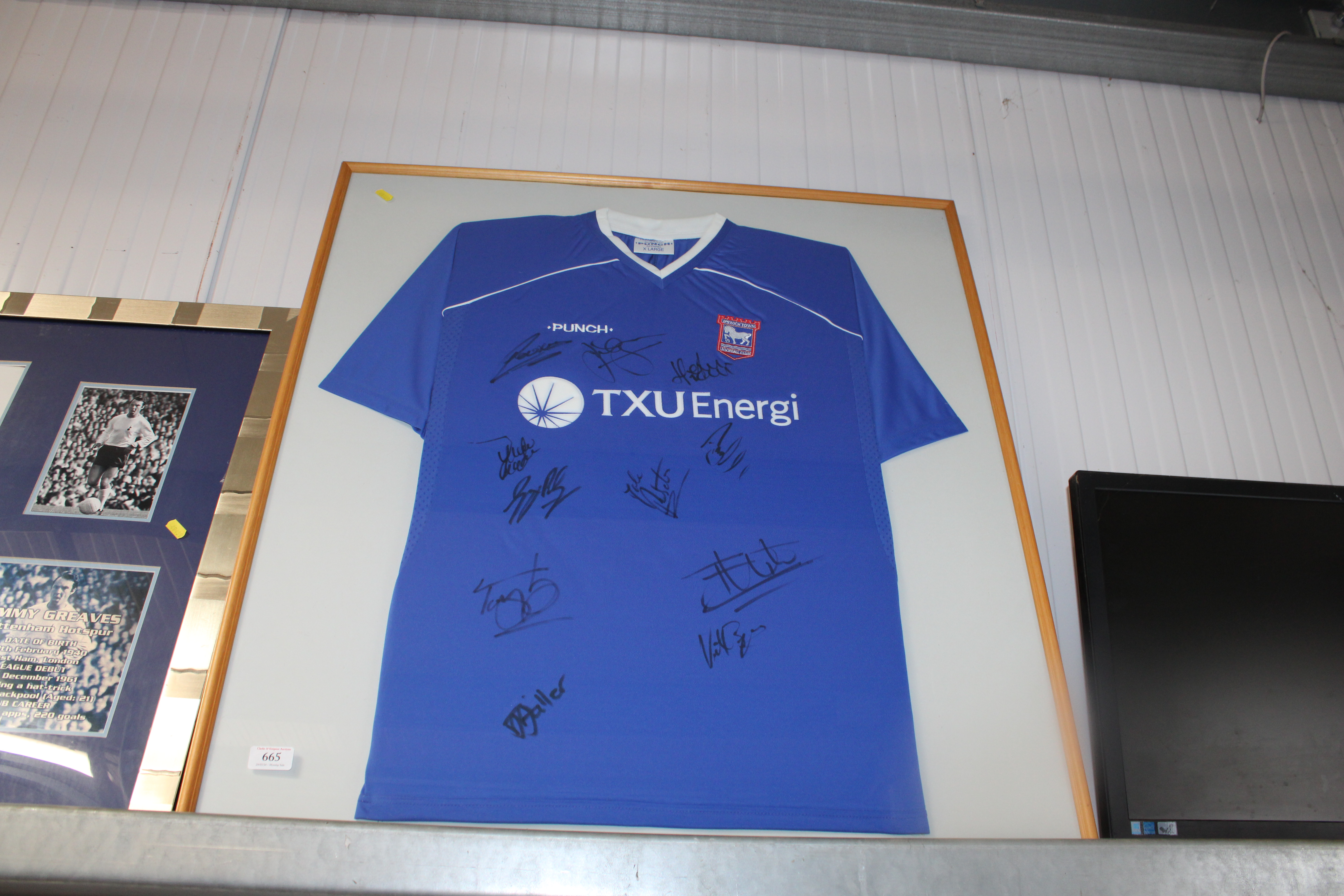 An Ipswich Town 2001 - 2003 framed football shirt bearing signatures