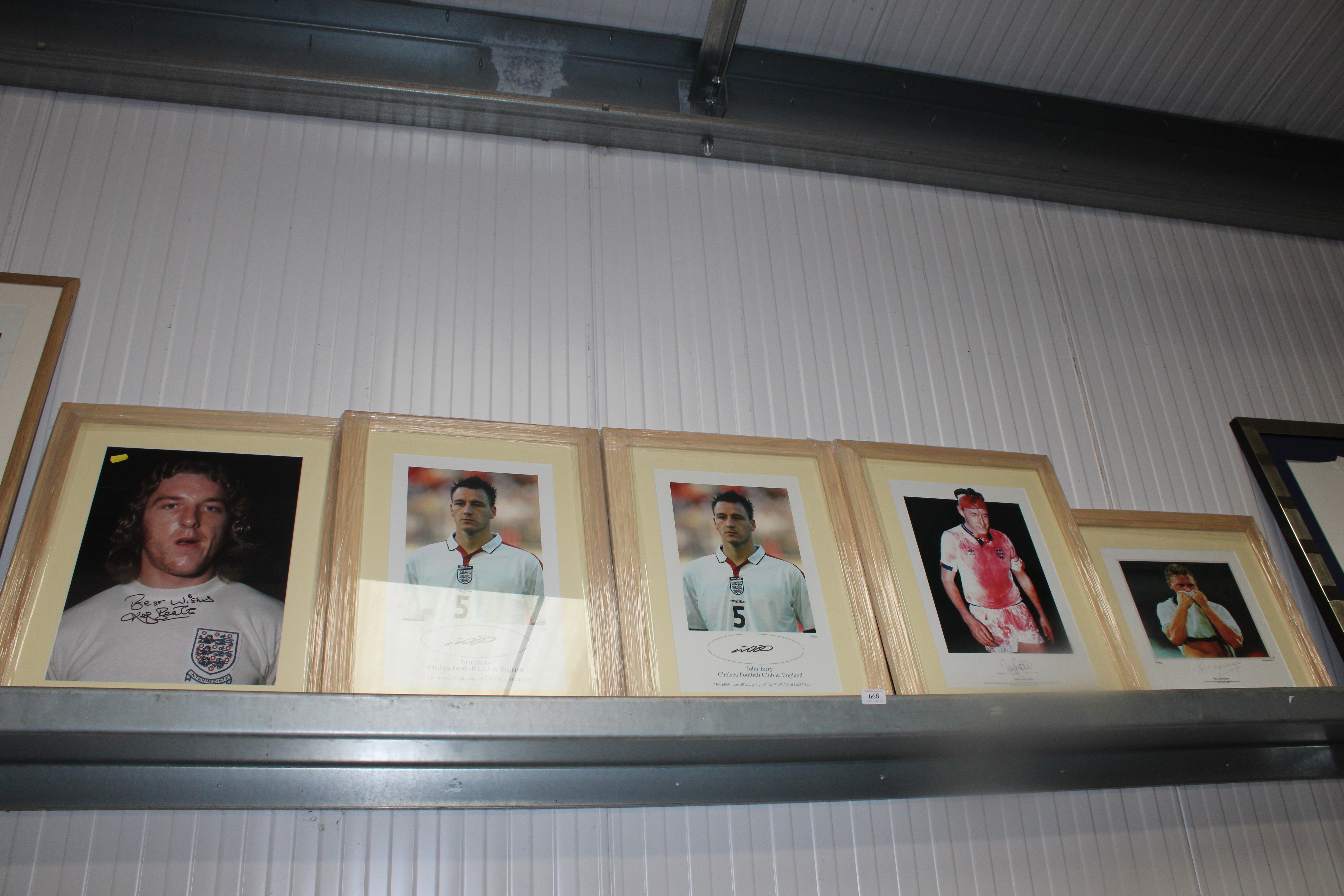 Five framed and glazed prints depicting football p