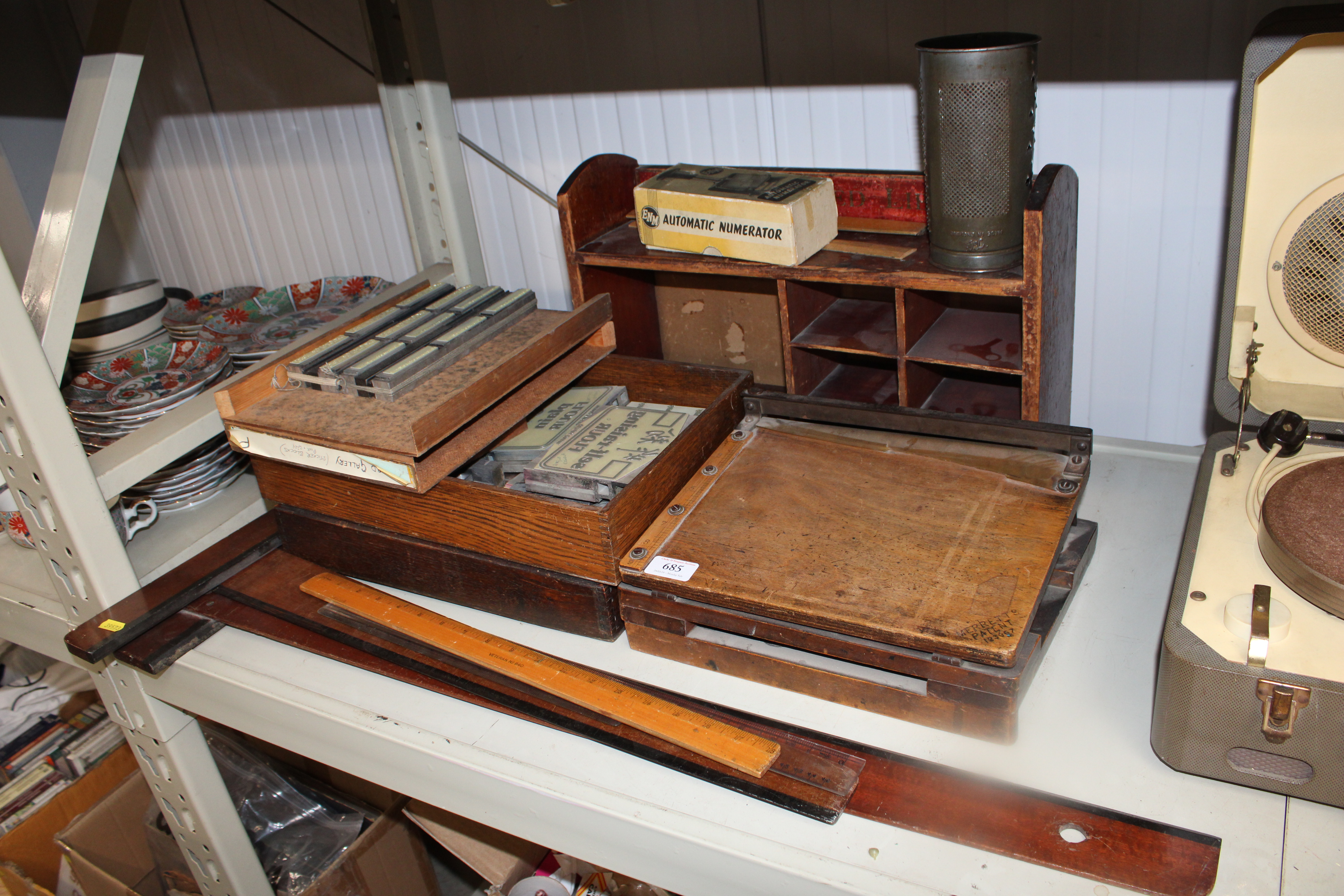 A set of wooden shelves; a quantity of printing bl