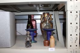 A pair of candlesticks; an ethnic figure; an Orien