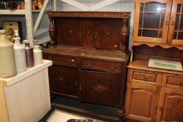 An oak court cupboard fitted two drawers