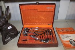 A box containing various stainless steel cutlery