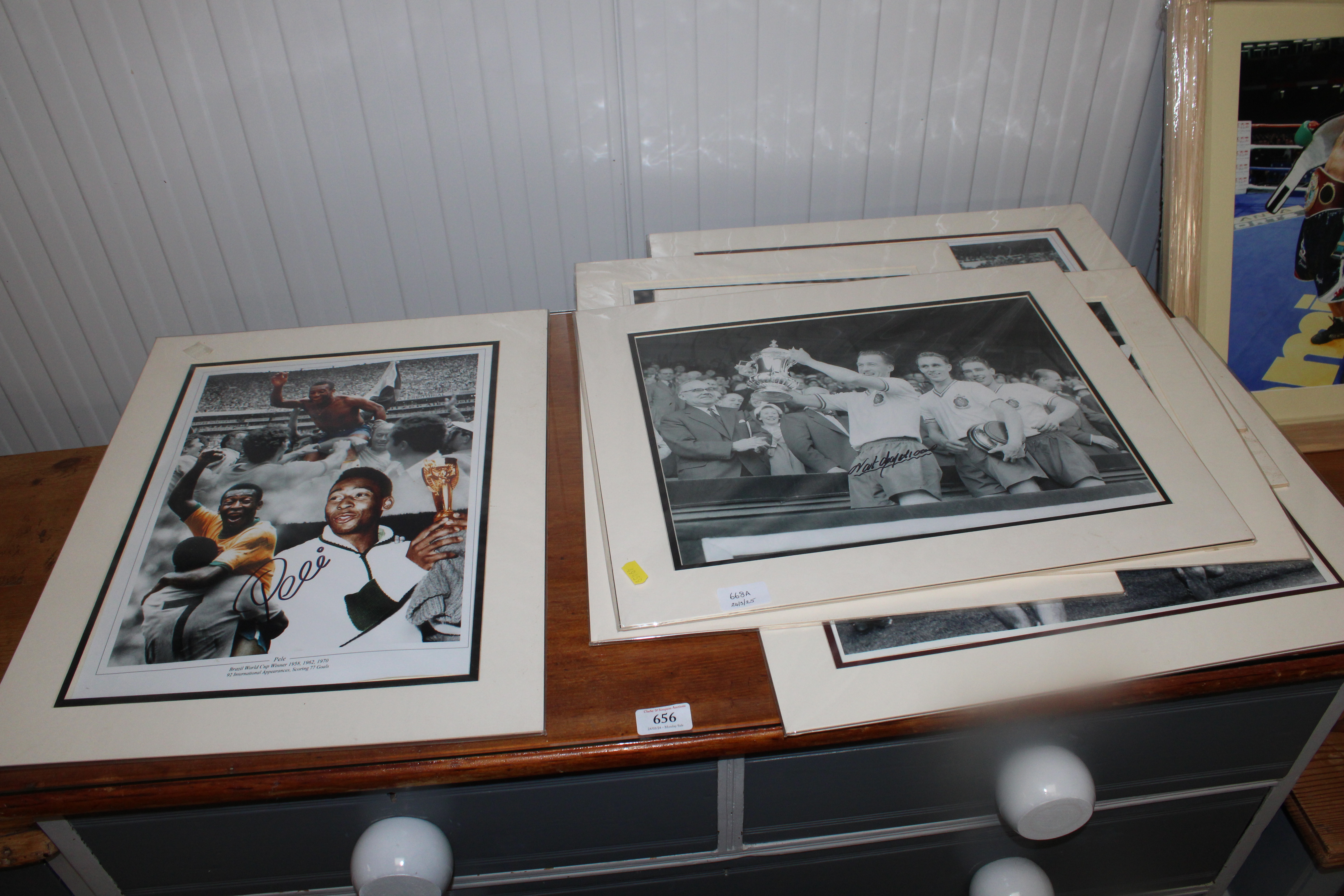 A collection of mounted photographs of footballers