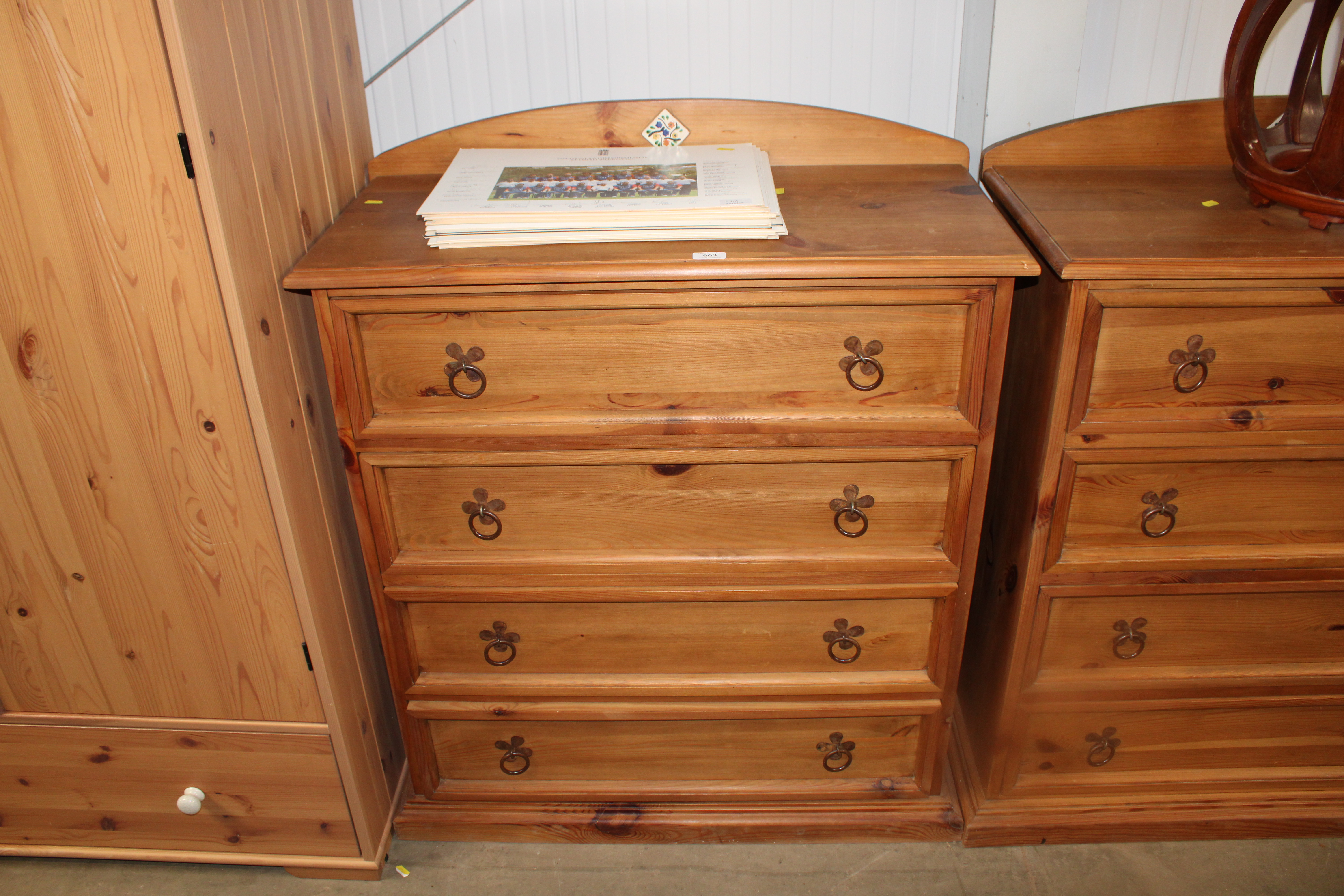 A pine chest fitted four long drawers having tile