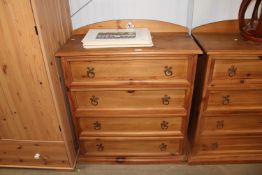 A pine chest fitted four long drawers having tile