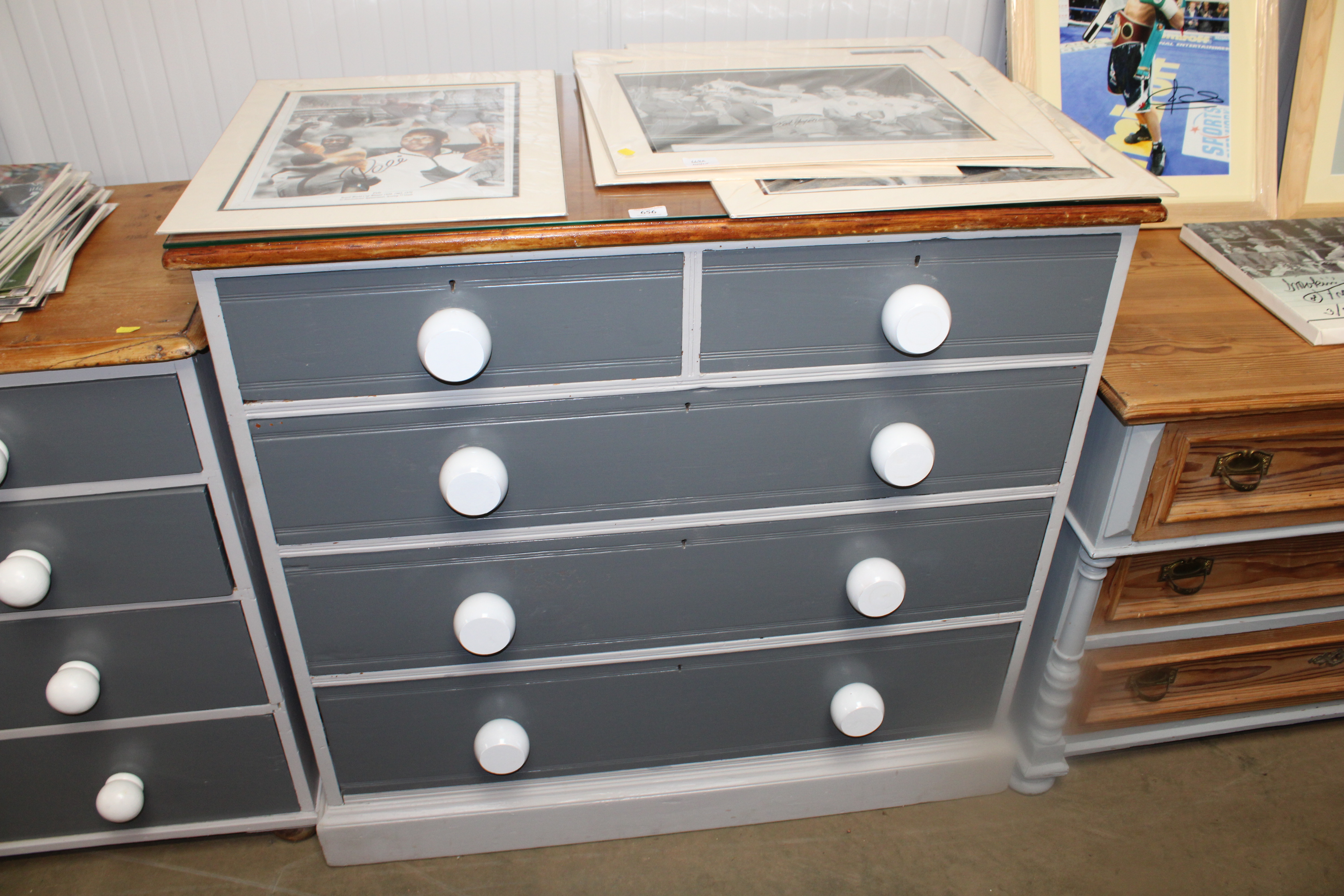 A part painted pine chest fitted two short over three long drawers having glass top.