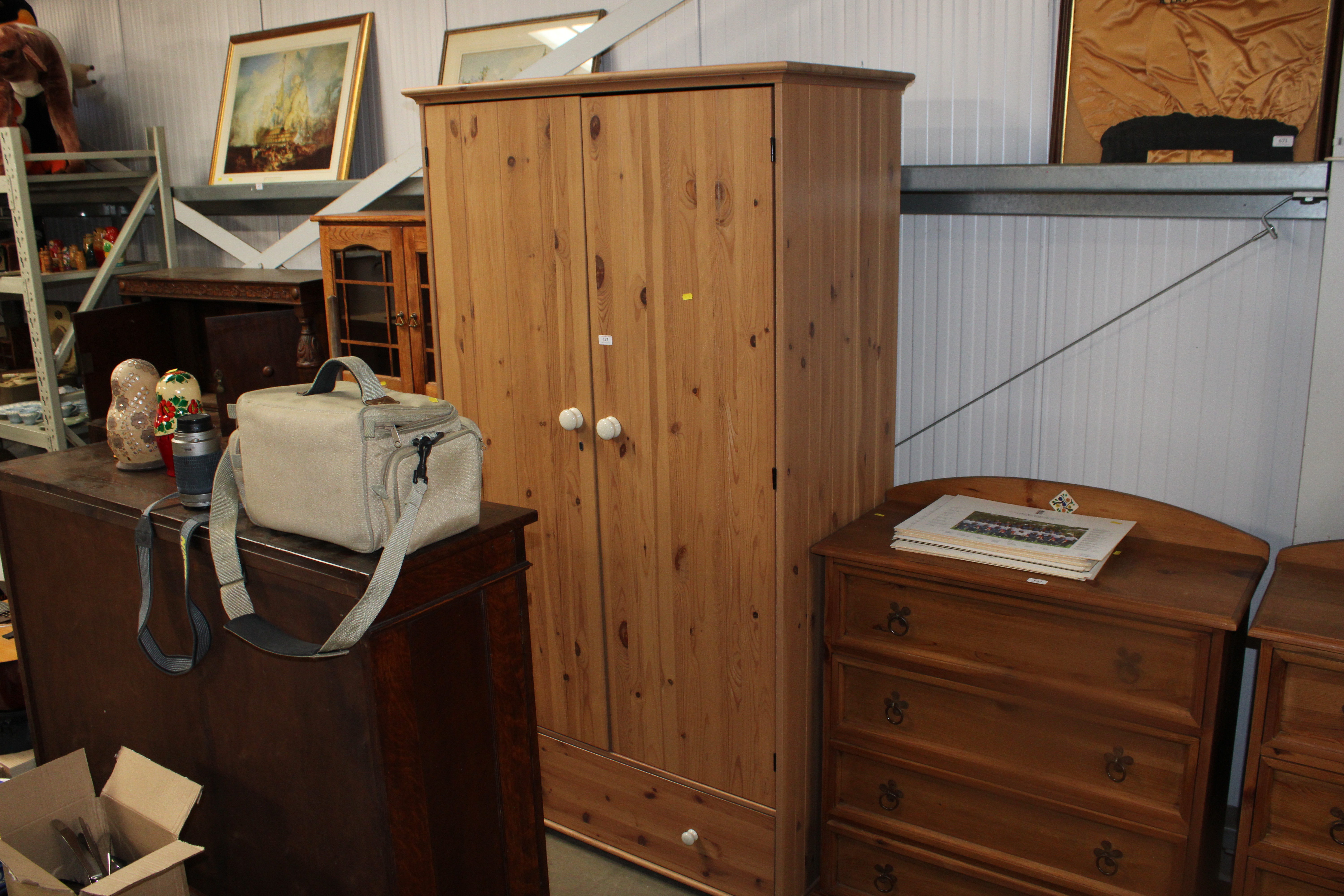 A modern pine two door wardrobe fitted single draw