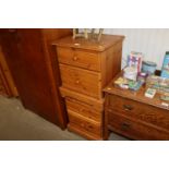A pair of pine bedside chests fitted two drawers