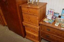 A pair of pine bedside chests fitted two drawers