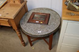 A wooden and brass topped occasional table with fo