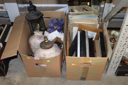 Two boxes containing various picture frames, mirro