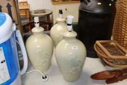 Three floral decorated china table lamps
