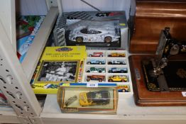 A collection of various boxed die cast vehicles to include Corgi 'Ford Cosworth', a GT racing Porche