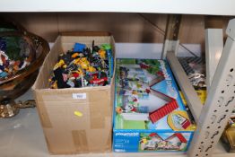 A collection of various Lego and Playmobile