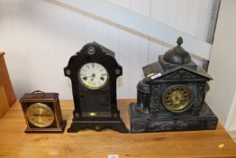 A black slate two hole mantel clock together with another two hole mantle clock and a Metamec
