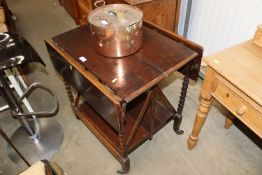 An oak folding tea trolley having label for the Tr