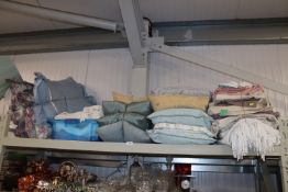 A large quantity of various linen, pillows etc.
