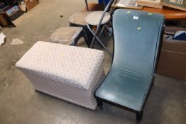 A blue upholstered nursing chair together with an