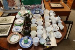 A collection of various commemorative mugs; blue a