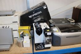 A Nespresso DeLonghi coffee machine and various ac