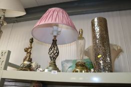 Three various table lamps together with a decorati