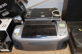 An HP printer/scanner together with an Epson print