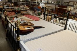 A brass and iron double bed frame together with a
