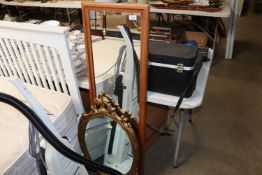 A gilt framed wall mirror; an oblong wall mirror a