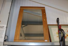 A modern oak framed and bevel edged wall mirror