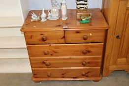 A modern pine chest fitted two short over three lo