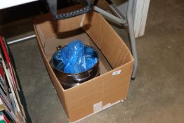 A box containing various kitchenalia