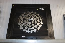 A framed modern wall light