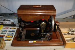 A The British Queen sewing machine in fitted case