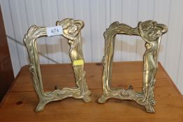 A pair of brass Art Nouveau style photo frames