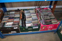 Three boxes containing various CDs
