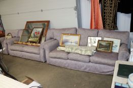 A purple upholstered three piece suite comprising