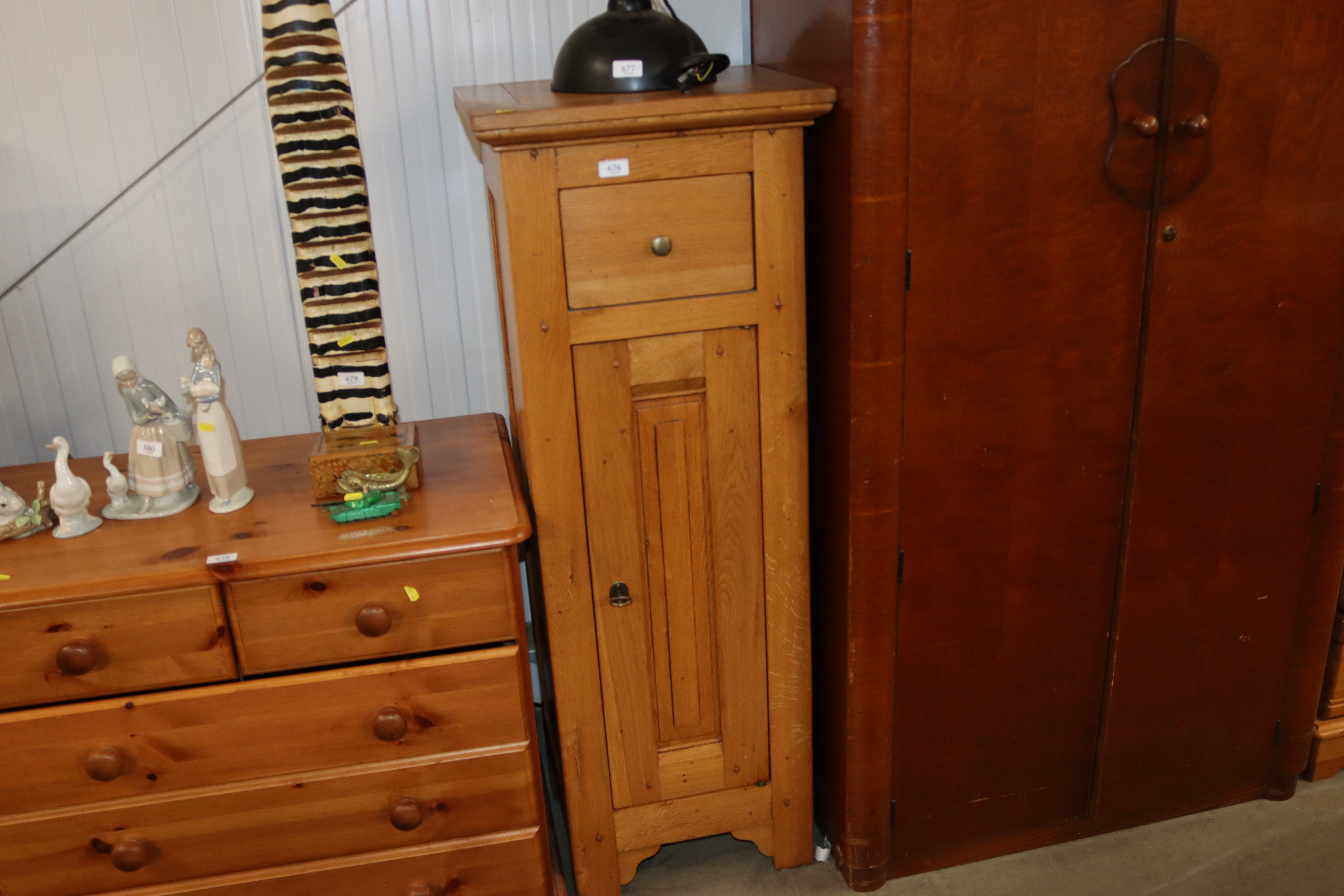 A modern oak storage unit, fitted single drawer