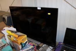 A Toshiba flatscreen television and remote control