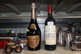 A bottle of Perrier- Jouet A Epernay Rose and a bottle of Chateau Des Valentons Canteloup Bordeaux