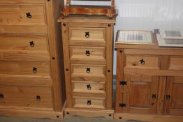 A modern pine chest fitted five drawers of narrow proportions