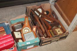 Two boxes containing various wooden cased clocks a