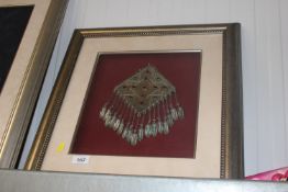 A framed and glazed study of Eastern White Metal wedding jewellery