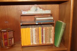 A set of Beatrix Potter books contained in a books